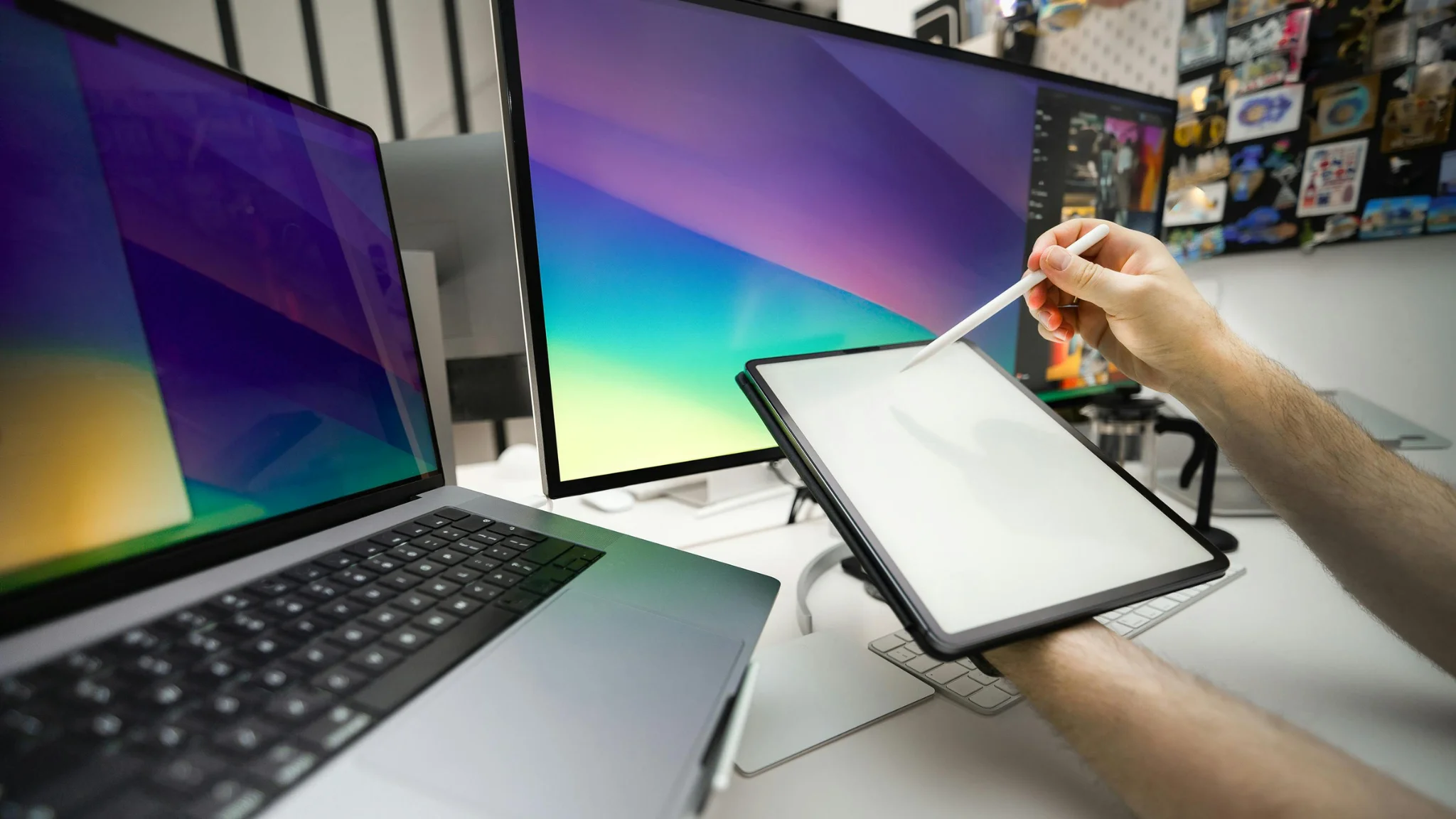 A person draws on a computer screen using a tablet, showcasing creativity and digital art skills.