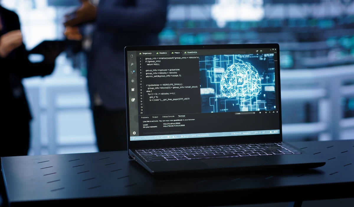 A laptop displaying an image of a brain, symbolizing technology and cognitive processes.