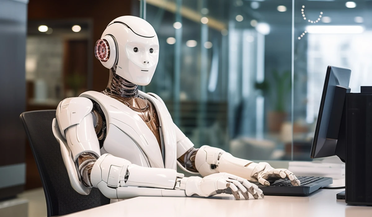 A robot working at a desk with a computer, illustrating a blend of technology and productivity.