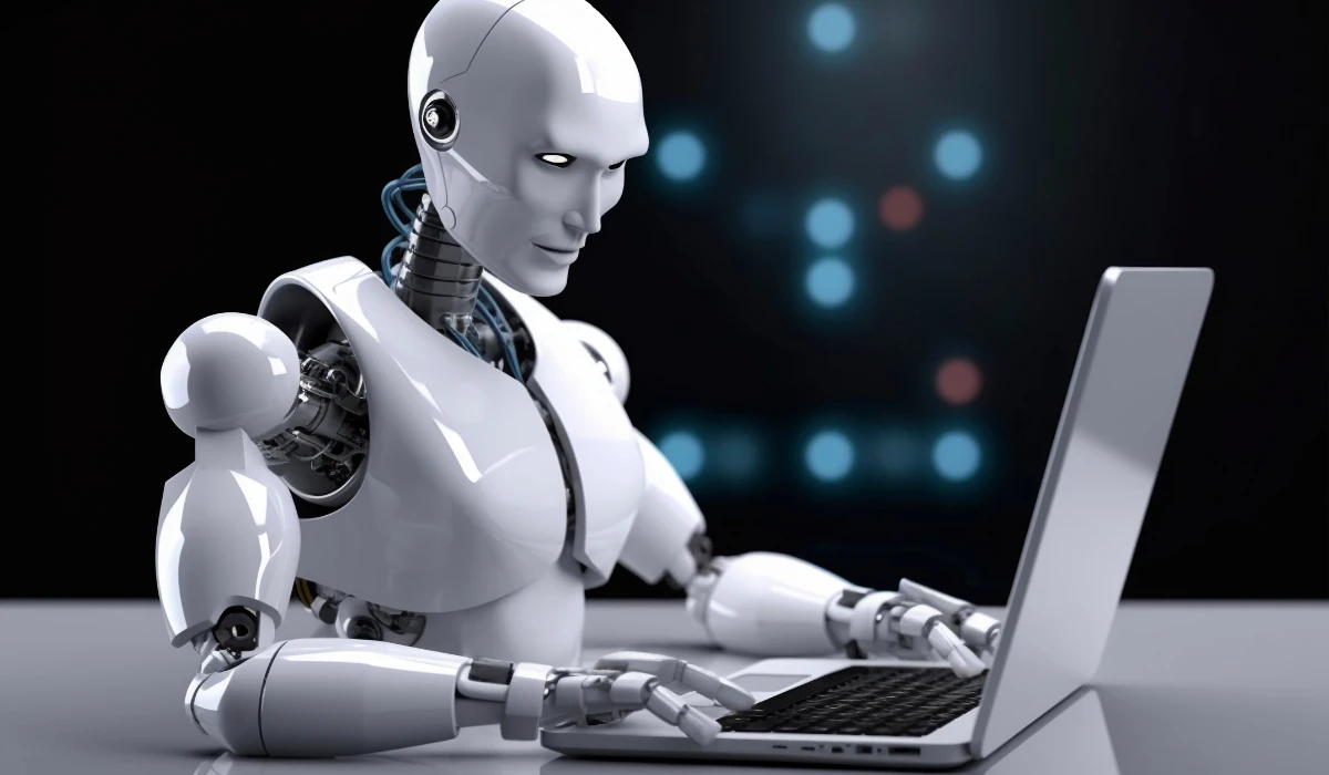 A robot engaged with a laptop, showcasing technology and innovation in a workspace.